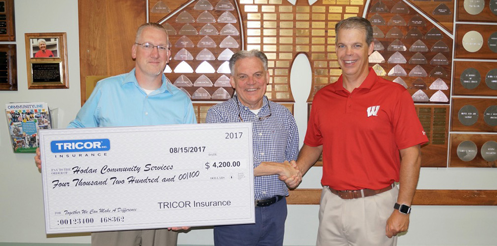 Hodan Community Service receives a check as the recipient of TRICOR's 2017 charity golf outing