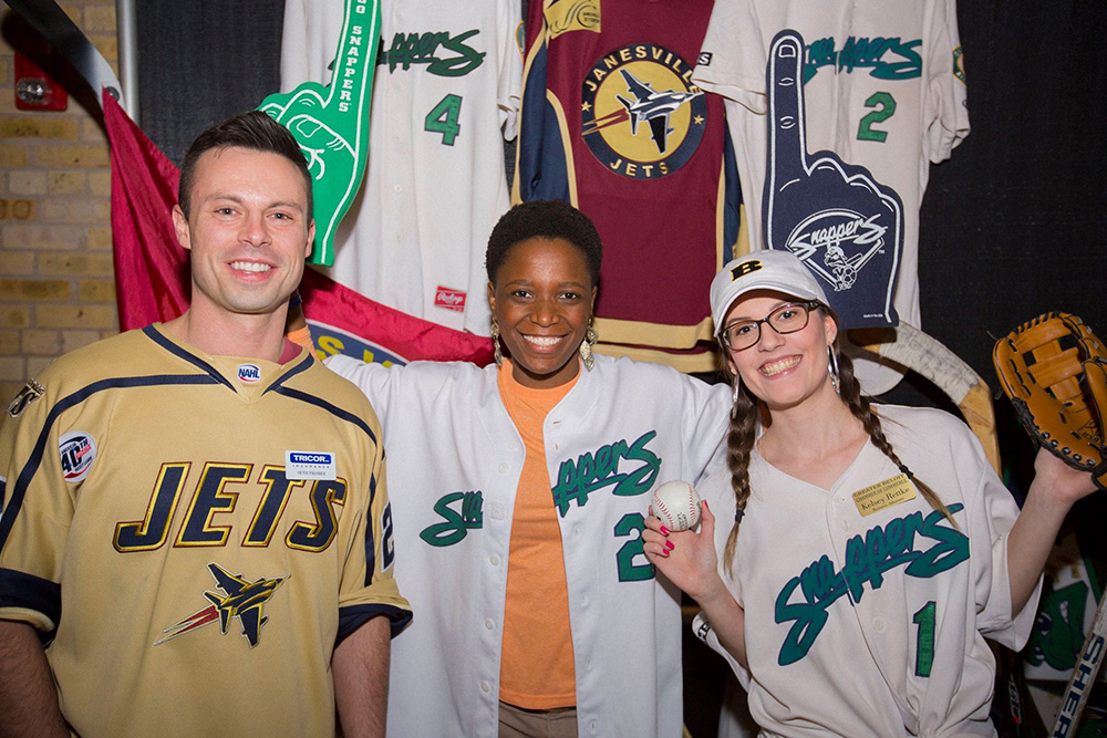 TRICOR employees wearing a variety of hockey jerseys at the Grapes & Hops fundraiser for KANDU Industries